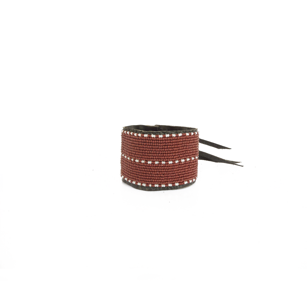 Black beaded bracelet with a strap on a white background